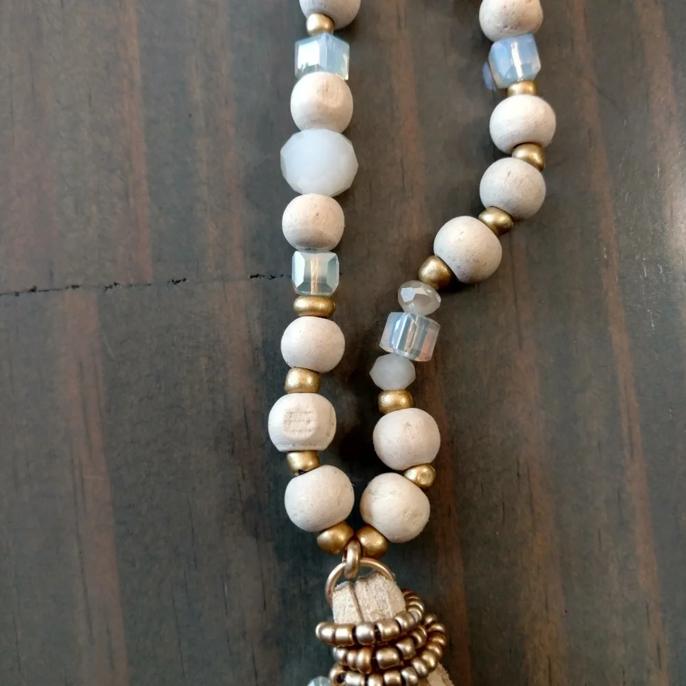 Wood, bead, crystal, and suede tassel necklace